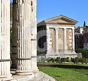 Tempio di Portuno from Tempio di Ercole Vincitore. Ancient Roman Greek classical style temples. Rome, Italy.