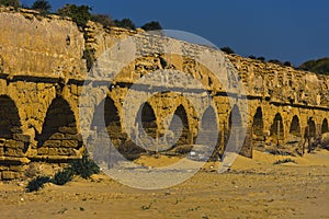 A Roman age aquaeductus in Caesarea northwest Israel in summer