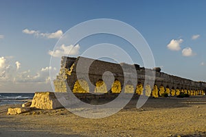 Roman age aquaeductus in Caesarea in sunset