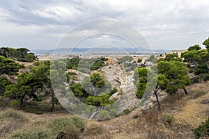 Roman Amphitheatre of Cagliari on a cloudy summer day photo