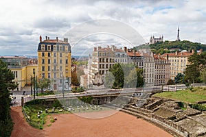 Roman ampitheatre in Lyon France with La Basilique Notre Dame and Metallic tower in the distance