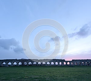 Roman aqueduct at dusk, Rome, Italy