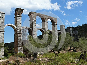 Roman aqueduct between olive trees. Lesvos. Greece