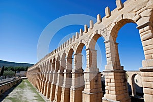 roman aqueduct, segovia, spain, under clear blue sky