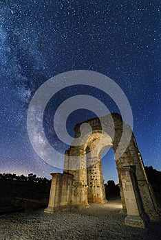 Roman arch of Caparra under the stars with the Milky Way photo