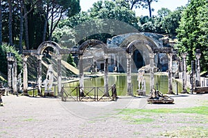 Roman archeology back view of canopo and statues