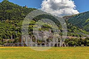 The Roman arches of the ampitheater stand proud at the foot of Mount Ingino in the city of Gubbio, Italy