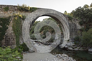 Roman bridge in the Alardos gorge in Madrigal de la Vera, Caceres, Extremadura, Spain, Europe. photo