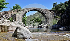 Roman Bridge in the Alardos Gorge in Madrigal de la Vera. photo