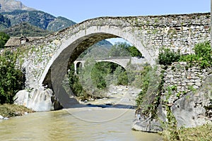 Roman bridge at Giornico on Leventina valley photo