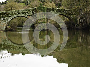 Roman bridge over the Arnoia river photo
