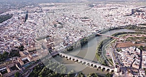 Roman Bridge over the Guadalquivir from aerial panoramic view with Mosque-Cathedral in Cordoba