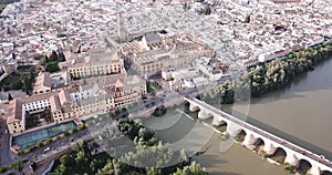 Roman Bridge over the Guadalquivir from aerial panoramic view with Mosque-Cathedral in Cordoba