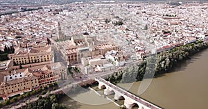 Roman Bridge over the Guadalquivir from aerial panoramic view with Mosque-Cathedral in Cordoba