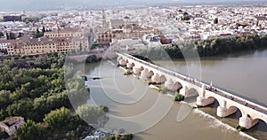 Roman Bridge over the Guadalquivir from aerial panoramic view with Mosque-Cathedral in Cordoba