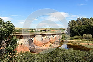 Roman bridge and Rio Tinto in Niebla village, Huelva province, Andalusia, Spain photo