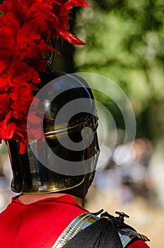 roman centurion with his back turned at a historical reenactment party