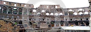 Roman Colosseum interior, Roma, Italy with Tourist