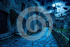 Roman Forum at night, Rome, Italy. Mystery creepy view of Ancient street in full moon