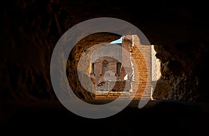 Roman Forum ruins through a hole on the wall