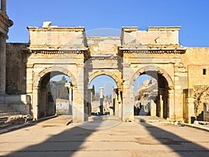 Roman gate arc ruins with stone columns row in ephesus Archaeological site in turkey