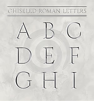 Roman letters chiseled in marble stone.