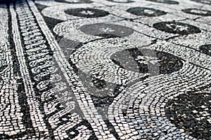 Roman mosaic black and white representing a decoration. Chain an