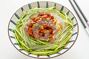 Roman noodle with pork sauce and cucumber close up. Chinese food. Za Jiang Mian