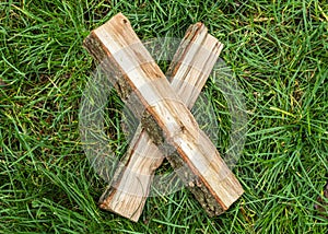 Roman numeral. Roman numerals made from oak. Old wood numbers. Old roman antique alphabet number on green grass background. Number