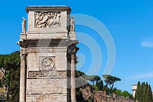 Roman pillar, end of Arch of Constantine and the Colosseum Rome, Italy
