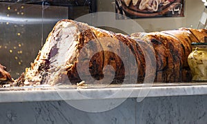 Roman Porchetta is a typical street food. It is roasted together with various fragrant spices which give the meat a delicious