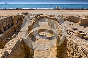 Roman ruins with arches in Caesarea Maritima Israel.