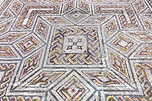 Roman ruins of Conimbriga. Close-up on a complex Roman tessera mosaic pavement center