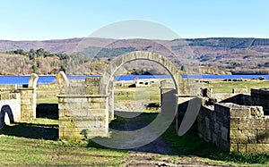 Roman ruins with lake. Aquis Querquennis archaeological site, arched stone door. BaÃÂ±os de Bande, Orense, Spain. photo