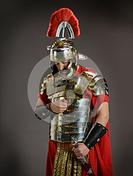 Roman soldier in actitude of submission photo