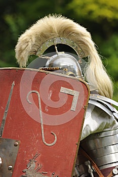 Roman soldier behind shield