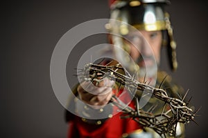 Roman Soldier holding a crown of thorns