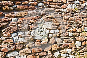 Roman stone and brick damaged wall background Italy