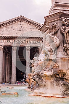 Roman temple Pantheon view with a fountain, Italy