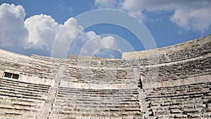 Roman Theatre against the background of moving clouds in Amman, Jordan