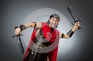 The roman warrior with sword against background
