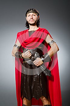 The roman warrior with sword against background