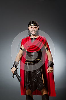 The roman warrior with sword against background