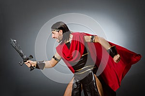 Roman warrior with sword against background