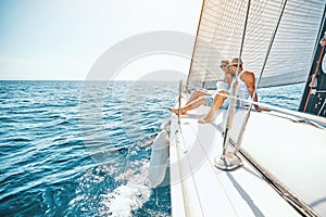 Romance on cruise ship in the summer.- couple hugging on a yacht