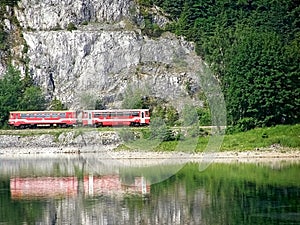 Romance and dreaming in nature train around water.