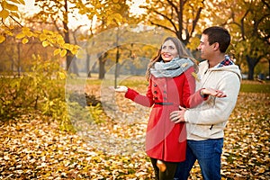 Romance in park with yellow leaves in autumn