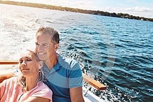 Romance out at sea. a mature couple enjoying a relaxing boat ride.