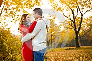 Romance between two young persons in autumn