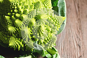 Romanesco Broccoli or Cauliflower on Wooden Table